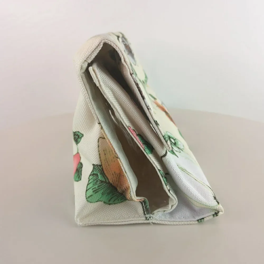 Clinique cream floral print fold over makeup / jewelry bag.